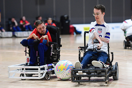 Marcus Harrison (L) of the England powerchair football team and Riley Johnson (R) of the United States of America powerchair football team seen in action during the FIPFA Powerchair Football World Cup 2023 match between USA and England at Quaycentre. Final score; England 1:0 USA.