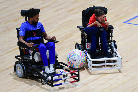 Bryan Weiss (L) of the France powerchair football team and Marcus Harrison (R) of the England powerchair football team seen in action during the FIPFA Powerchair Football World Cup 2023 match between France and England at Quaycentre. France won the penalty shootout 2-1.