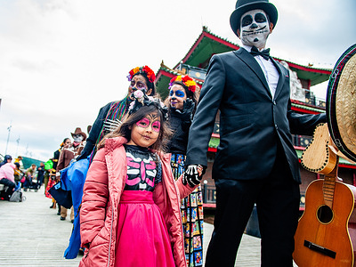 A Mexican man and his daughter are seen wearing traditional Mexican costumes. The Mexican Talent Network in collaboration with the Embassy of Mexico in the Netherlands celebrated the Day of the Dead. Ten days before the official celebration the organizers invite the Mexican community in the Netherlands and all interested people to celebrate the Day of the Dead. The Day of the Dead, or "Día de los Muertos" in Spanish, is a traditional Mexican festival where families honor and remember deceased loved ones, believing that the spirits return to the world of the living during this time. Peopleoften dress up as Catrina or Catrín, the female and male skeletons the celebration is known for.