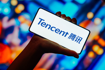 In this photo illustration, the Tencent logo is displayed on a smartphone screen.