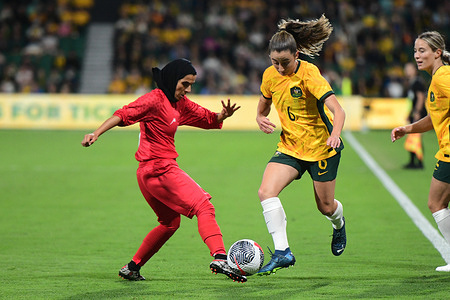 Zahra Sarbali (L) of the Islamic Republic of Iran women's football team and Clare Wheeler (R) of the Australia women's football team in action during the 2024 AFC Women's football Olympic Qualifying Round 2 Group A match between Australia and Islamic Republic of Iran held at the Perth Rectangular Stadium. 
Final score Australia 2:0 Islamic Republic of Iran.