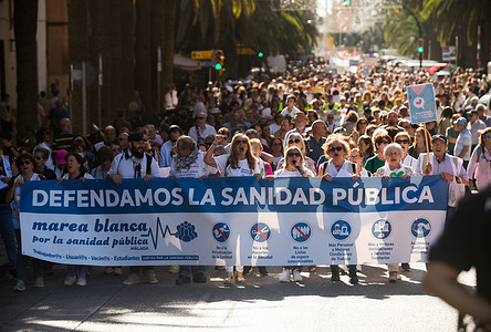 Protesters march through the street while holding a banner expressing their opinions during the demonstration. Under the slogan: "They are stealing our healthcare and our lives", thousands of people are seen in the streets in support of state public health and services and against privatization of health system.