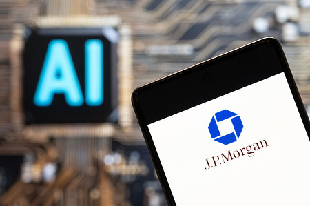 In this photo illustration, the American multinational investment bank and financial services company J.P. Morgan (NYSE: JPM) logo seen displayed on a smartphone with an Artificial intelligence (AI) chip and symbol in the background.