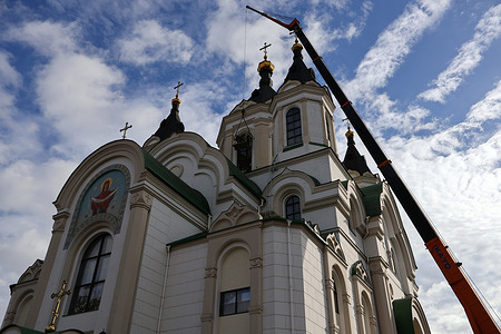 A jib (crane) operated by servicemen to fix the broken window at the Holy Intercession Cathedral damaged after the Russian missile strike in Zaporizhzhia. Russia and Ukraine gave clashing accounts over the weekend about what is going on along the frontline in the Zaporizhzhia region, with Moscow saying it has stopped Kyiv's counter-offensive and Ukraine's army saying it keeps pressing on. Ukraine has retaken a few small villages in the southeastern Zaporizhzhia region since the start of its counteroffensive in June, but progress has been small and the vast frontline in the country's east and south has changed little over the past year.