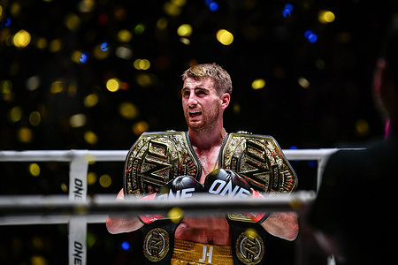 Jonathan Haggerty of England seen carrying title boxing belts during the match of ONE Fight Night 16 at Lumpinee Boxing Stadium.