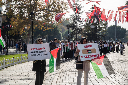 Female demonstrators in Sultanahmet Square hold placards saying "killer Israel" and "save Palestine" during a sit-in protest. On the 8th day of their 15-day sit-in protest in Sultanahmet Square, the Solidarity Initiative with Palestinian Women shows support for Gaza in light of the recent conflict between the Palestinian armed group Hamas and the Israel Defense Force. Their goal is to end the occupation and violence in Gaza and promote a ceasefire between Hamas and Israel.
