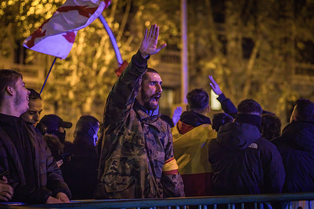 A protester chants slogans while making a gesture on Ferraz Street during the rally against President Pedro Sanchez and the amnesty law in favor of pro-independence Catalan politicians.