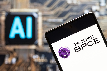 In this photo illustration, the French banking group, Groupe BPCE logo seen displayed on a smartphone with an Artificial intelligence (AI) chip and symbol in the background.
