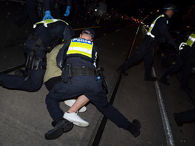 Police tackle a pro-Palestine protester who ran through a police line at the counter-protest. After a Burgertory chain-restaurant owned by Palestinian-Australian Hesham Tayah burned overnight in Melbourne's most-Jewish suburb, Pro-Palestine protesters gathered in a nearby park where violent exchanges occurred with pro-Israel counter-protesters. Police deployed pepper spray on both sides and made one arrest.