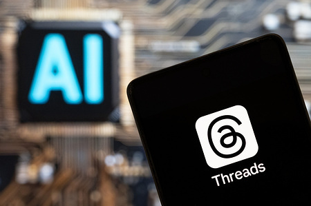 In this photo illustration, the online social media and social networking service operated by Meta Platforms, Threads, logo seen displayed on a smartphone with an Artificial intelligence (AI) chip and symbol in the background.