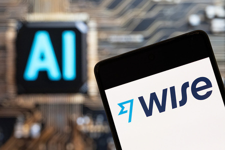 In this photo illustration, the UK-based foreign exchange financial technology company Wise logo seen displayed on a smartphone with an Artificial intelligence (AI) chip and symbol in the background.