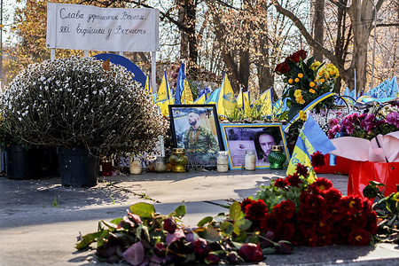 Portraits of a soldiers, flowers and Ukrainian flags are seen at a memorial dedicated to the fallen soldiers of Ukrainian armed forces in Zaporizhzhia. NATO Secretary-General Jens Stoltenberg has called on Ukraine's allies to continue giving Kyiv all the necessary military support it needs in its war against Russia's aggression and warned that they have to be prepared for a protracted battle, even as Russian shells continued to cause fatalities to civilians and damage to infrastructure sites in the east and south of the country.