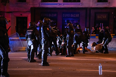 Members of the national police drag protesters who did not want to leave the street in central Madrid during the protest. The ninth consecutive day of demonstrations with heavy riots clashes in Madrid. More than 1,000 people threw pyrotechnics, glass bottles, stones and cans at the police and the press in the context of the amnesty for the former president of the Catalan government Carles Puigdemont and the investiture of Pedro Sanchez, the current president of Spain.