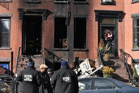 Investigators sift through the debris and investigate the fire. Three people were killed and several people were injured after a fire in a brownstone in Crown Heights, Brooklyn, New York, United States on November 12, 2023. Three people were killed and others were injured in a fire on Albany Avenue in the Crown Heights section of Brooklyn, New York Sunday morning. The fire is under investigation by the FDNY and NYPD.