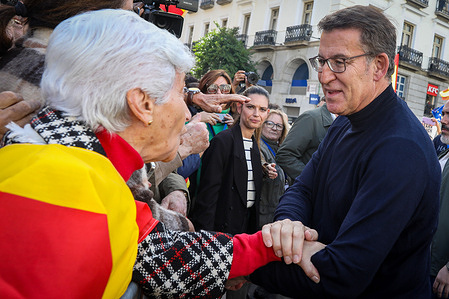 The leader of the Spanish popular party Alberto Núñez Feijoo greets his supporters in the Puerta del Sol square during the demonstration. The demonstration called by the Popular Party (PP) in all provincial capitals in protest against a future amnesty law after the prime minister’s Spanish Socialist Workers’ Party (PSOE) pact with Junts and Republican Left of Catalonia (ERC) has brought together more than 80,000 people in Madrid, according to data from the Government Delegation. The PP raised the figure to one million attendees in Madrid and around two million people who would have mobilized in the 52 Spanish provinces.