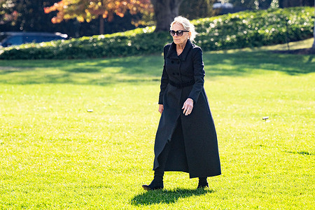 First Lady Jill Biden walking on the South Lawn towards the White House.