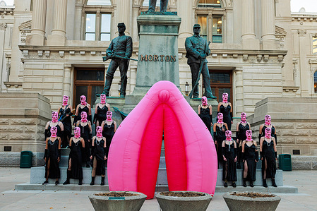 Russian activist group Pussy Riot films a music video for a song titled, “God Save Abortion,” to protest Indiana’s near-total abortion ban, on the steps of the Indiana Statehouse in Indianapolis. Nadya Tolokonnikova, a founder of Pussy Riot, who is wanted by the Russian government, directed the filming.