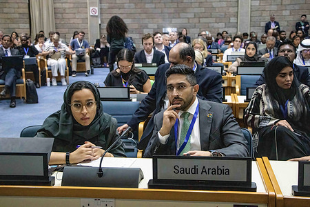 Saudi Arabian delegates follow the day's proceedings during the Intergovernmental Negotiating Committee's third meeting to formulate an international legally binding plastics treaty by 2024.