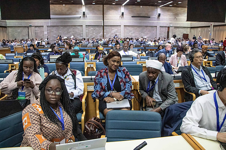 Kenyan delegates follow day 3 proceedings during the Intergovernmental Negotiating Committee third round of discussions to craft a plastics treaty that will address the impact plastic pollution including pellet loss and toxic chemical additives.