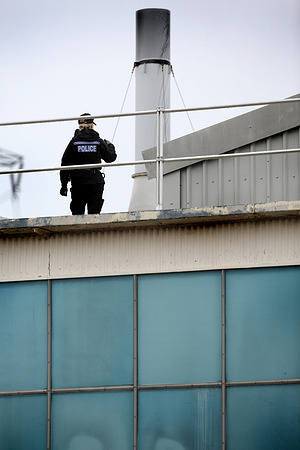 A police officer is seen on guard on the roof as emergency services clear the roof of protesters. Palestine Action occupies the roof of the Italian arms industry, giant Leonardo at their factory in Southampton. Leonardo supplies Israel with fighter jets and weaponry that are currently being used in Gaza. Palestine Action demands that arms companies providing weapons for Israel should be shut down permanently. They have announced that companies selling weapons to the Israeli Defence Force and their partner companies will be targeted with direct action. These actions are intended to highlight the plight of Palestinians in Gaza and the West Bank but also disrupt the manufacturing in those businesses. Palestine Action has declared it will not stop its actions until the arms industry stops supporting Israel.