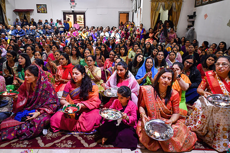 Women sing during a Diwali celebration. Diwali is celebrated in Scranton at the Shree Swaminarayan Hindu Temple. Diwali is the Hindu New Year and celebrates light over darkness.