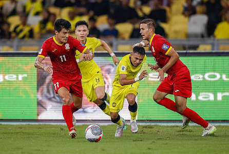 Bekzhan Sagynbayev of Kyrgyz Republic (L1), Stuart Wilkin (L2), Mohamad Faisal Halim (R2) of Malaysia and Abdurakhmanov Odilzhon of Kyrgyz Republic (R1) in action during the 2026 World Cup/2027 Asian Cup Qualifiers match between Malaysia and Kyrgyz Republic at the National Stadium Bukit Jalil. Final score; Malaysia 4:3 Kyrgyz Republic