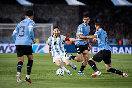 Lionel Messi of Argentina and Matias Viña of Uruguay in action during a FIFA World Cup 2026 Qualifier match between Argentina and Uruguay at Estadio Alberto J. Armando. Final Score: Argentina 0:2 Uruguay