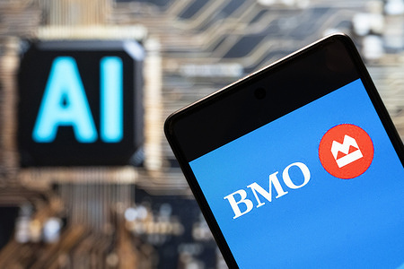 In this photo illustration, the Canadian multinational banking and financial services corporation The Bank of Montreal (BMO, TSE: BMO) logo seen displayed on a smartphone with an Artificial intelligence (AI) chip and symbol in the background.