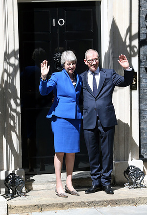 Theresa May (L), accompanied by husband Philip May, makes a final speech outside 10 Downing Street before visiting Queen Elizabeth II to officially resign as Prime Minister of the United Kingdom in London.