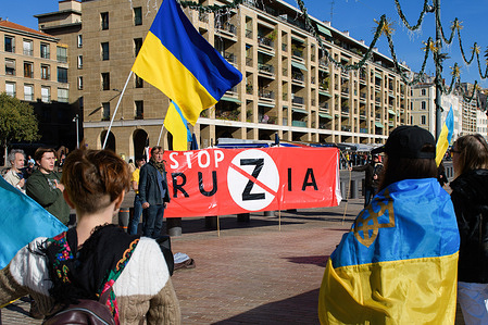 A "stop ruzia" banner and Ukrainian flags seen during a protest. A group of Ukrainian people protest against war and Russia in front of the town hall of Marseille. Since the start of the war in Ukraine on 24 February 2022, almost 3,000 refugees have arrived in the Bouches-du-Rhône.