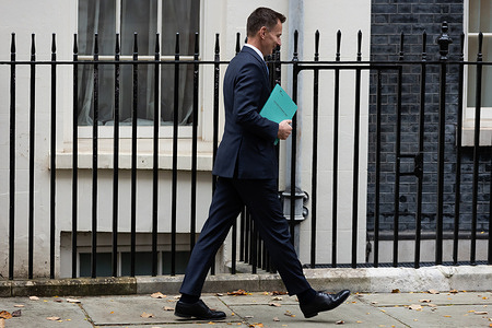 Chancellor Jeremy Hunt leaves 11 Downing Street to present the Autumn Statement to Parliament in London. Hunt is expected to cut taxes with inflation having halved to 4.8% and better than expected fiscal headroom.
