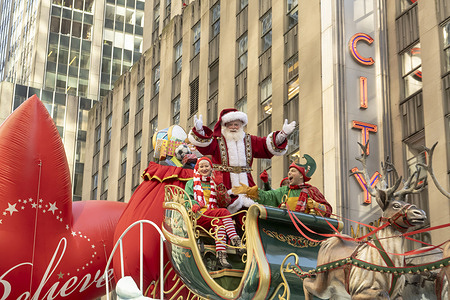 Santa Claus and Elfs seen on Santas Sleigh float during the Macy's Annual Thanksgiving Day Parade in New York City.