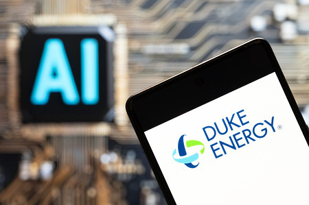 In this photo illustration, the American electric power and natural gas holding company Duke Energy (NYSE: DUK) logo seen displayed on a smartphone with an Artificial intelligence (AI) chip and symbol in the background.