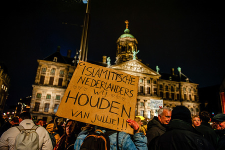 A protester holds a placard in solidarity with the Muslims during a demonstration. Protesters staged a rally in solidarity with Muslims and immigrants following the victory of the far-right political party PVV (Party from Freedom under far-right leader Geert Wilders) in the general election. Protesters rally against Wilder's ideas, which have put certain groups like Muslims and immigrants at high risk. Wilders will still need other parties to join him in a coalition to govern with majority support in parliament.