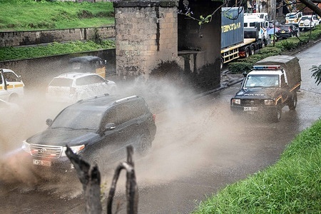 A vehicle splashes storm water on a highway in Nakuru amid increased rainfall attributed to the El-Nino phenomenon.