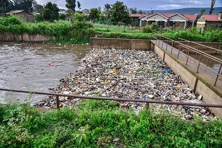 Plastic waste of all kind drifts on a storm water channel that drains into Lake Nakuru. The increased rainfall attributed to El-Nino is transporting trash littered on streets through drains exacerbating plastic pollution at Lake Nakuru.