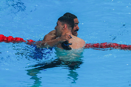 Gabriel Silva (Brazil) hugs Vicente Almonacid (Chile) in the men's 200m medley SM8 final, during the STGO 2023 Parapan American Games at the Parque Estadio Nacional Aquatic Center.