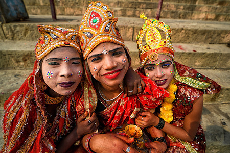 Little children dressed as Hindu Mythological Characters to collect offerings during the festival. Dev Deepavali / Diwali is the biggest festival of light celebration in Kartik Poornima (Mid-Autumn) where devotees decorate the river bank with millions of lamps during the festival.