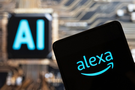 In this photo illustration, the virtual assistant technology owned by Amazon, Alexa, logo seen displayed on a smartphone with an Artificial intelligence (AI) chip and symbol in the background.