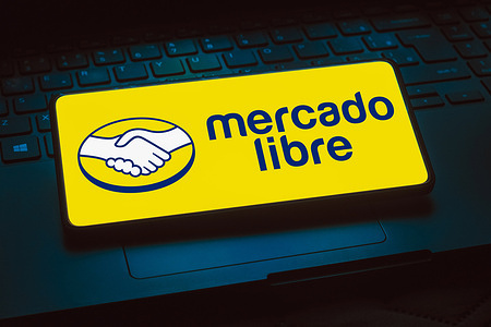 In this photo illustration, the Mercado Libre logo is displayed on a smartphone screen.