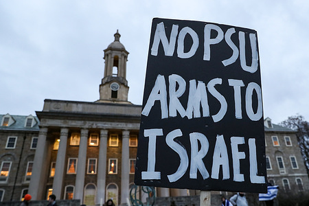A placard is seen during a pro-Palestine rally outside of Old Main on the campus of Penn State University. Protesters gathered at Penn State's Allen Street gates then marched to Old Main to present their demands to the university administration. The demands include total divestment from weapons manufacturers and a condemnation of "Israel's ongoing war of genocide on Palestine."