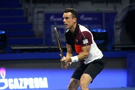 Roberto Bautista Agut of Spain plays against Alexander Bublik ( not pictured) of Kazakhstan during the exhibition tennis match of the North Palmyra Trophies - International Team Exhibition Tennis Tournament at KSK Arena. 
Final score; Alexander Bublik 2:1 Roberto Bautista Agut.