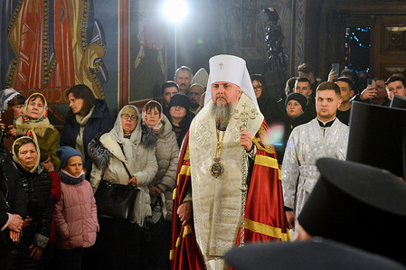 Metropolitan Epiphanius of Kyiv attends a Christmas Eve prayer service at the St. Michael's Golden-Domed Cathedral in Kyiv. Ukrainians are preparing to celebrate Christmas on December 25 for the first time, following a governmental decision to shift the date from January 7, traditionally observed by most Orthodox believers. This adjustment stands as a deliberate divergence from Russia.