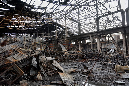 A view of a damaged warehouse following a Russian missile attack in Kyiv. Ukrainian officials reported that a massive Russian airstrike occurred overnight on December 28 to 29, resulting in the deaths of at least 30 individuals. This strike deemed the most extensive bombardment in the ongoing 22-month invasion, affected both military targets and civilians across the country, including Kyiv. President Volodymyr Zelensky stated that nine people were killed and 30 others wounded in Kyiv when a warehouse and several other buildings were hit.