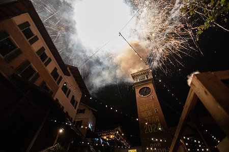 Fireworks seen at the clock tower in the One Nimman building in Nimman district to celebrate the New Year 2024.
