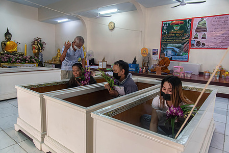 Buddhist devotees sit inside coffins as part of a resurrection ceremony at Wat Bang Na Nai Temple. Every New Year, Buddhist worshippers in Bangkok partake in a resurrection ceremony. During this ritual, participants are cleansed of their negative karma and are believed to receive blessings of good health and fortune for the upcoming year.