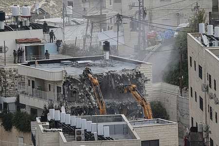 Israeli forces demolish a building belonging to a Palestinian in Jerusalem. Israeli forces detain Palestinians protesting against the demolition of their buildings, which they claimed as unlicensed at Jabel Mukaber Neighborhood in East Jerusalem.