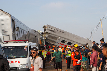 Scene from the train crash of the Bandung Raya Local Train in Cicalengka. A collision between two trains occurred on Java, Indonesia's main island, resulting in several carriages buckling, overturning, and leading to at least three fatalities, as reported by officials. Hery Marantika, head of Bandung's Search and Rescue Agency, stated that approximately 106 passengers from the commuter train and 54 from the Turangga have been rescued. The cause of the accident is still under investigation.