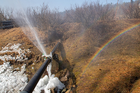 A view of a leaking water pipe which has formed icicles and a rainbow in the outskirts village of Srinagar. Kashmir is currently in the middle of the 40-day harsh winter period known locally as 'Chilla-i-Kalan.' During this time, an extreme cold wave engulfs the Himalayan region, causing temperatures to plunge to minus 20 degrees. This results in freezing of water bodies, including the globally renowned Dal Lake, and water supply lines in various parts of the valley.