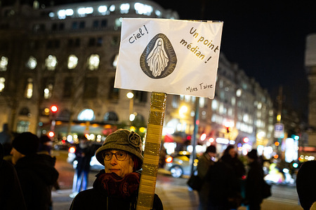 A woman holds a placard with a vulva's image during the feminist demonstration. Several feminist associations call for rallies all over France to defend victims of sexual violence and to denounce Emmanuel Macron’s support for Gérard Depardieu, indicted for rape. In Paris, dozens of demonstrators gathered at Place St. Augustin to protest against sexual violence.